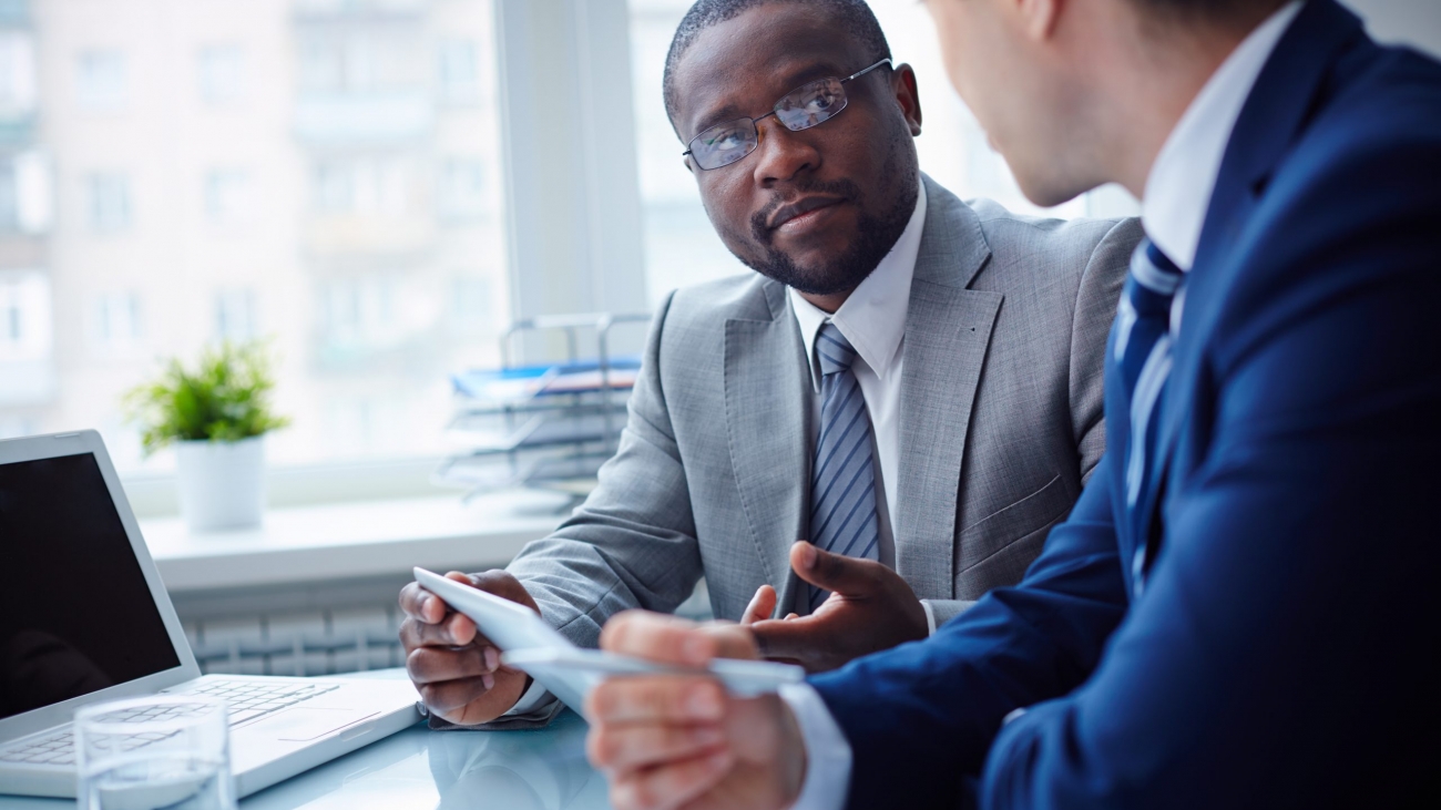 Image,Of,Two,Young,Businessmen,Interacting,At,Meeting,In,Office