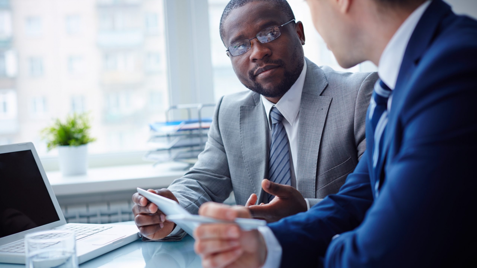 Image,Of,Two,Young,Businessmen,Interacting,At,Meeting,In,Office